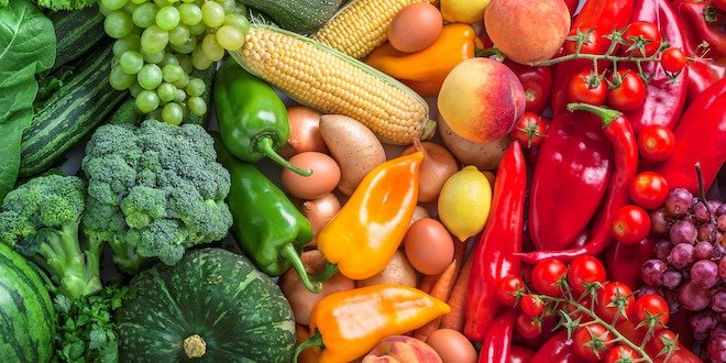 Fruits and vegetables overhead assortment on colorful background sugar in fruits and vegetables