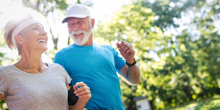 Beautiful mature couple jogging in nature living healthy stay active diabetes