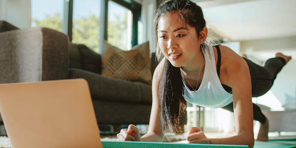 Woman watching sport training online on tablet exercise videos