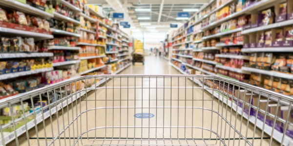 Unrecognizable supermarket aisle as background food insecurity