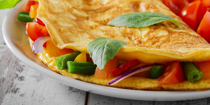 omelet with vegetables and cherry tomatoes