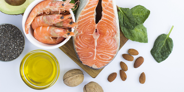 Top view of food sources of omega-3 on the white background. Copy space. Food hight in fatty acids. omega 3 and blood pressure