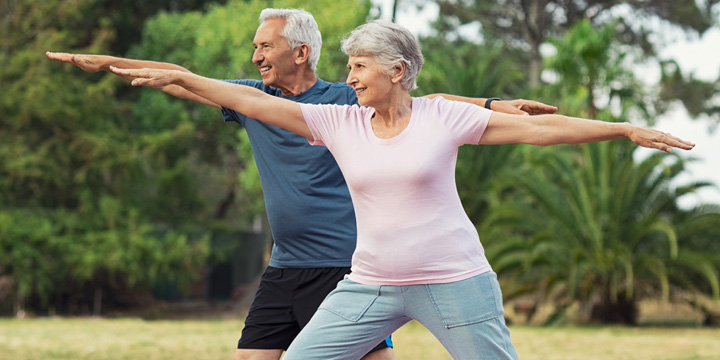 man and woman doing stretching exercise couple exercise