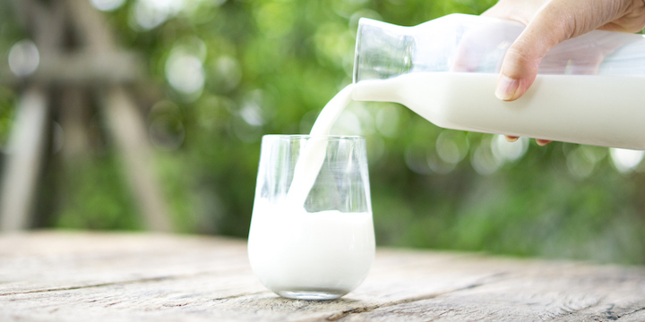 Pouring milk. skim milk