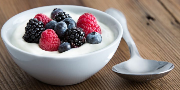 Bowl of fresh mixed berries and yogurt