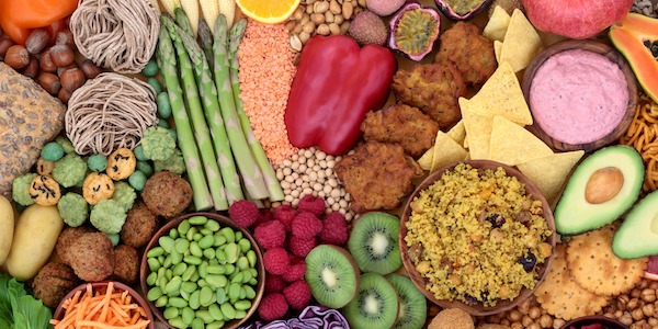 Large Vegan Health Food Collection for Vitality Large vegan health food collection for vitality with foods high in antioxidants, protein, omega 3, lycopene, minerals, vitamins, anthocyanins & fibre. Plant based & ethical eating concept. Flat lay.