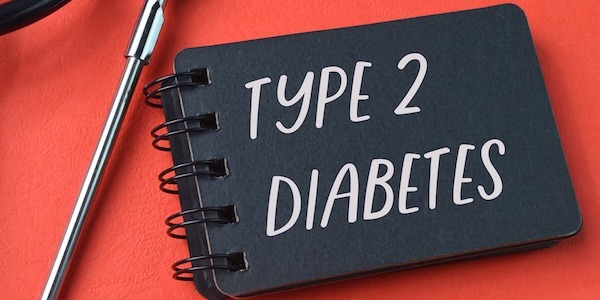 Stethoscope and notebook with text TYPE 2 DIABETES Stethoscope and notebook with text TYPE 2 DIABETES